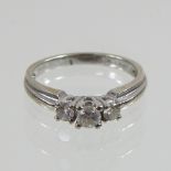 An 18 carat white gold three stone diamond ring