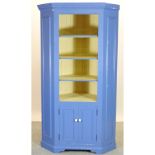 A blue painted pine standing corner cabinet,