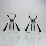 A pair of small black and glass fan shaped perfume bottles,