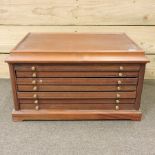 A 20th century wooden six drawer coin chest,