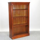 A cherrywood open bookcase,