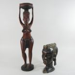 An African carved hardwood figure, 63cm high,