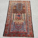 A Baluchi style prayer rug, on a red ground,