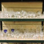 Three shelves of glassware,
