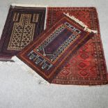 A woollen rug, with geometric designs on a red ground, 196 x 121cm,