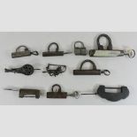 A collection of nine various locks,