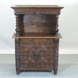A 19th century heavily carved oak jardiniere stand,