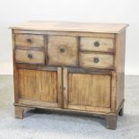 A 19th century mahogany side cabinet, containing an arrangement of drawers,