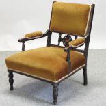 A Victorian rosewood and gold upholstered show frame armchair