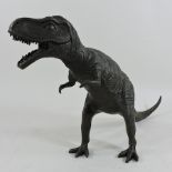 A bronze model of a tyrannosaurus rex dinosaur,