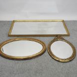 A gilt framed wall mirror, 73 x 130cm,