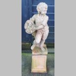 A terracotta figure of a boy, on a matching pedestal,