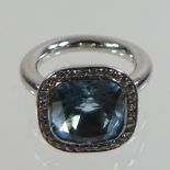 An 18 carat white gold blue topaz and diamond set cluster ring,