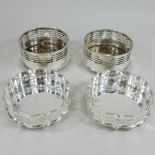 Two pairs of plated bottle coasters,