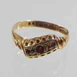 An antique 18 carat gold ruby and diamond ring,