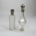 A French cut glass scent bottle, with a white metal top, 11cm high,