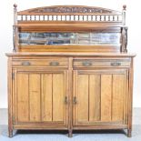 A Victorian walnut chiffonier, with a mirrored gallery back,