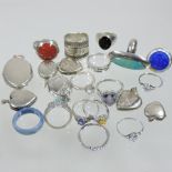 A collection of modern silver and costume rings and lockets