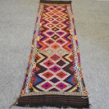 A Suzmi style kelim runner, with all over coloured diamond pattern,