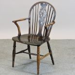 A 19th century fruitwood windsor armchair