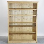 A modern pine open bookcase,