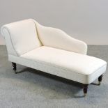 A Victorian style cream upholstered chaise longue,