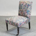 A floral upholstered Victorian nursing chair,