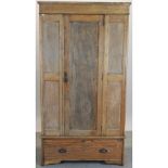 An early 20th century oak single wardrobe, with a panelled front,