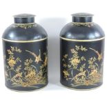 A pair of decorative tole style painted metal tea canisters,