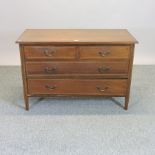 An Edwardian mahogany and inlaid chest of drawers,