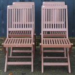 A set of four teak garden chairs