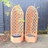 A pair of wooden garden trellis pots,