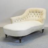 A Victorian cream upholstered chaise longue, on turned legs,