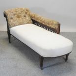 A Victorian walnut white upholstered chaise longue,