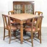 A 1930's oak draw leaf dining table, 152 x 91cm overall,