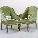 A pair of Edwardian inlaid and green upholstered armchairs