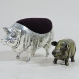 A reproduction pin cushion, in the form of a pig, 11cm long,