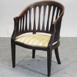 An early 20th century mahogany desk chair