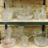 Two shelves of early 20th century and later cut and other glass vases,