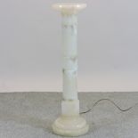 A carved alabaster jardiniere stand,
