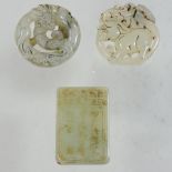 A collection of three 20th century carved jade coloured pendants,