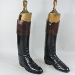 A pair of leather riding boots,