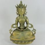 A gilt bronze figure of a seated Buddha,
