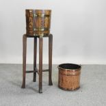 An Edwardian oak and brass coopered jardiniere on stand, 110cm high,