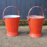 Two red painted galvanized fire buckets,