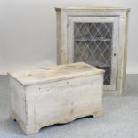 An antique pine glazed corner cabinet, together with a blanket box,