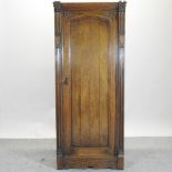 An early 20th century oak hall cupboard,