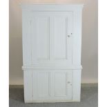 A 19th century white painted pine cupboard,