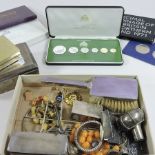 A collection of items to include a proof set of Franklin Mint Guyana coins, Danbury Mint coins,