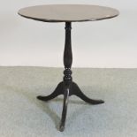 A 19th century oak occasional table, with a circular tilt top,